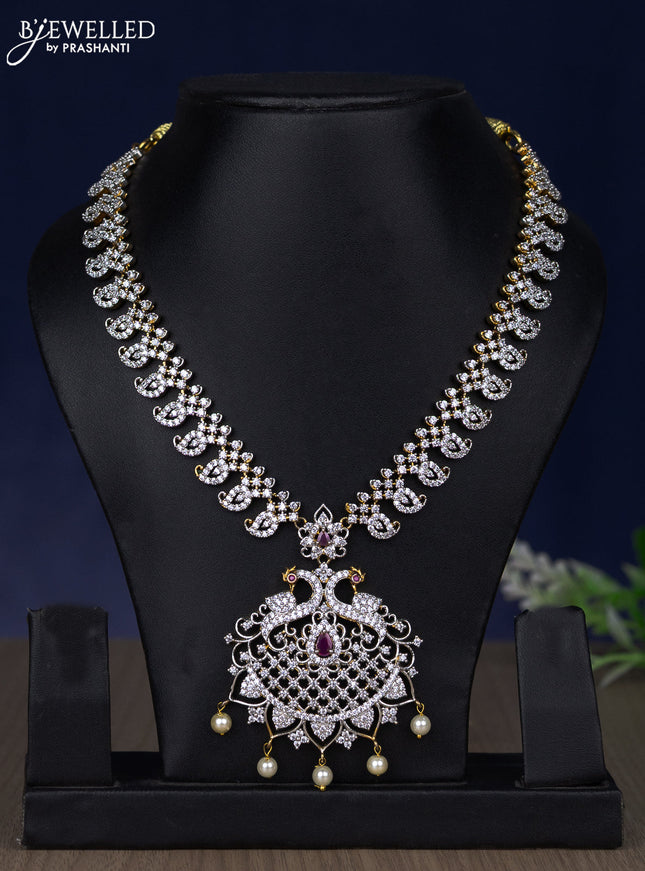 Zircon necklace peacock design with ruby & cz stones and pearl hangings in gold finish without earring