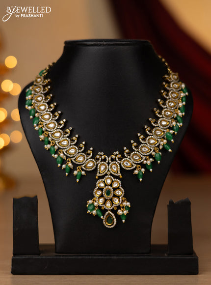 Necklace peacock design with emerald & cz stones and beads hangings in victorian finish without earring