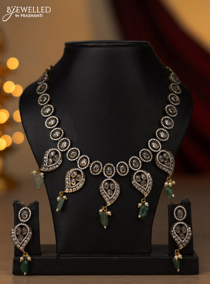 Necklace with emerald & cz stones and beads hangings in victorian finish