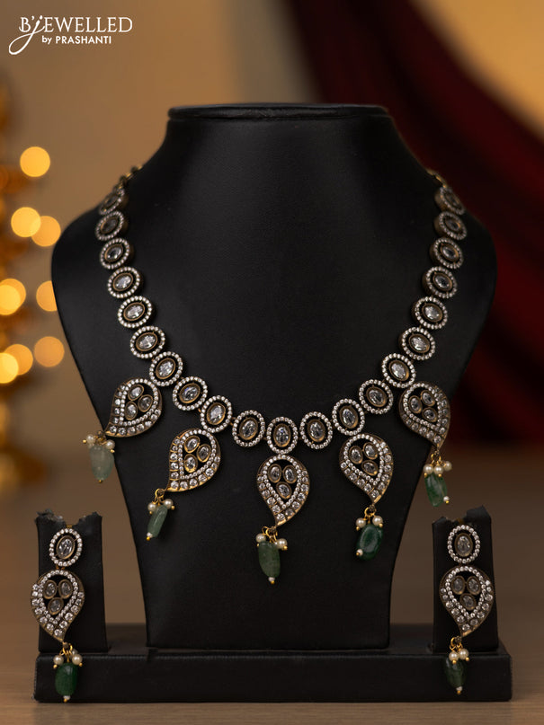 Necklace with emerald & cz stones and beads hangings in victorian finish