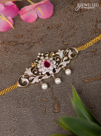 Zircon vanki with ruby & cz stones and pearl hangings in gold finish