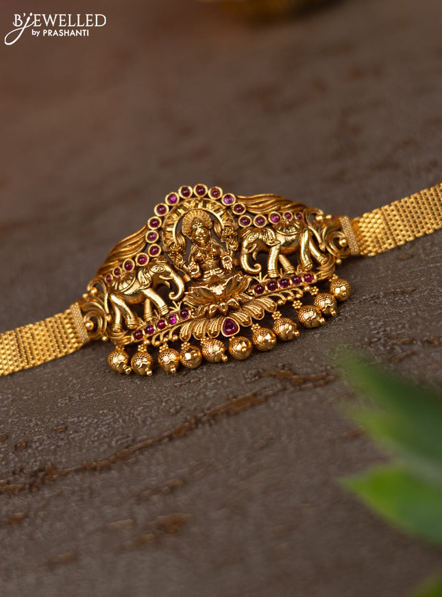 Zircon vanki peacock design with ruby & cz stones and pearl hangings in gold finish