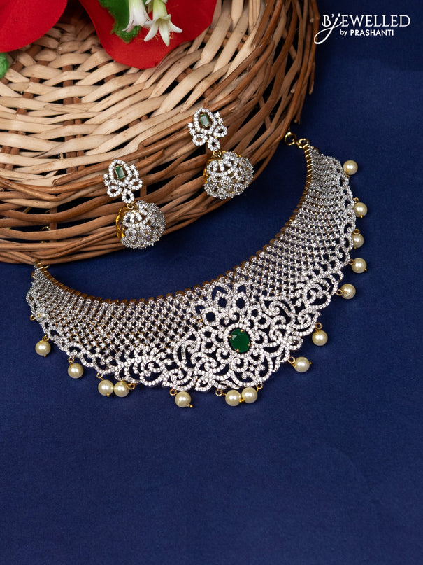 Zircon choker with emerald & cz stone and pearl hangings in gold finish