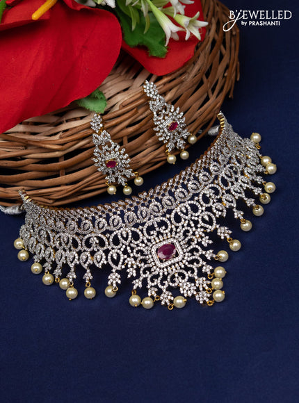 Zircon choker with ruby & cz stone and pearl hangings in gold finish