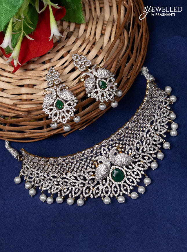 Zircon choker peacock design with emerald & cz stone and pearl hangings in gold finsh
