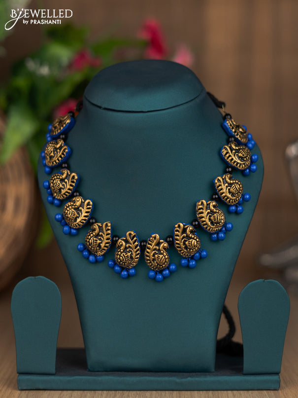 Terracotta blue necklace with peacock pendant