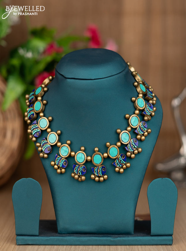 Teracotta necklace with fish design pattern and golden beads hangings without earring