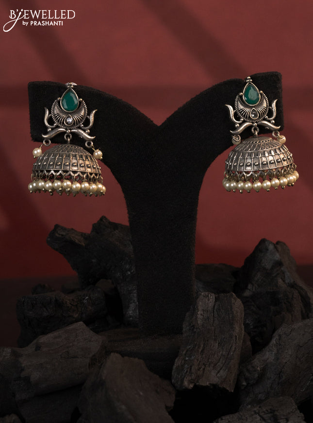 Oxidised jhumkas with emerald stones and pearl hangings