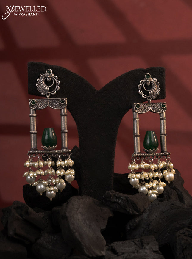 Oxidised earrings with emerald stones and pearl hangings