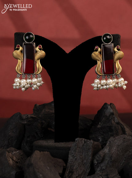 Oxidised earrings peacock design with kemp stones and pearl hangings