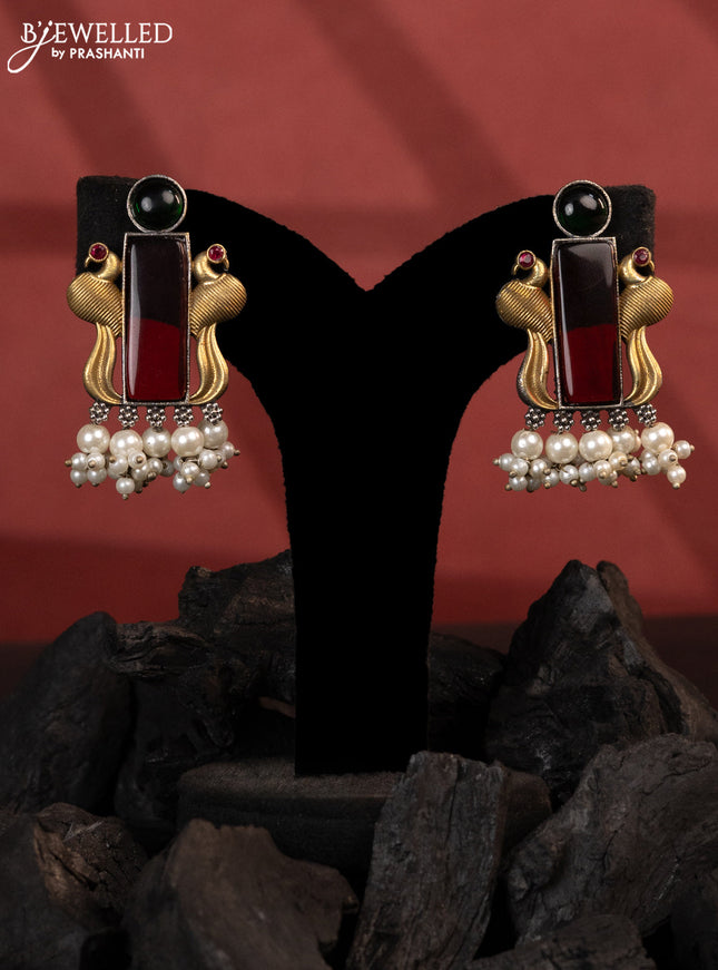 Oxidised earrings peacock design with kemp stones and pearl hangings