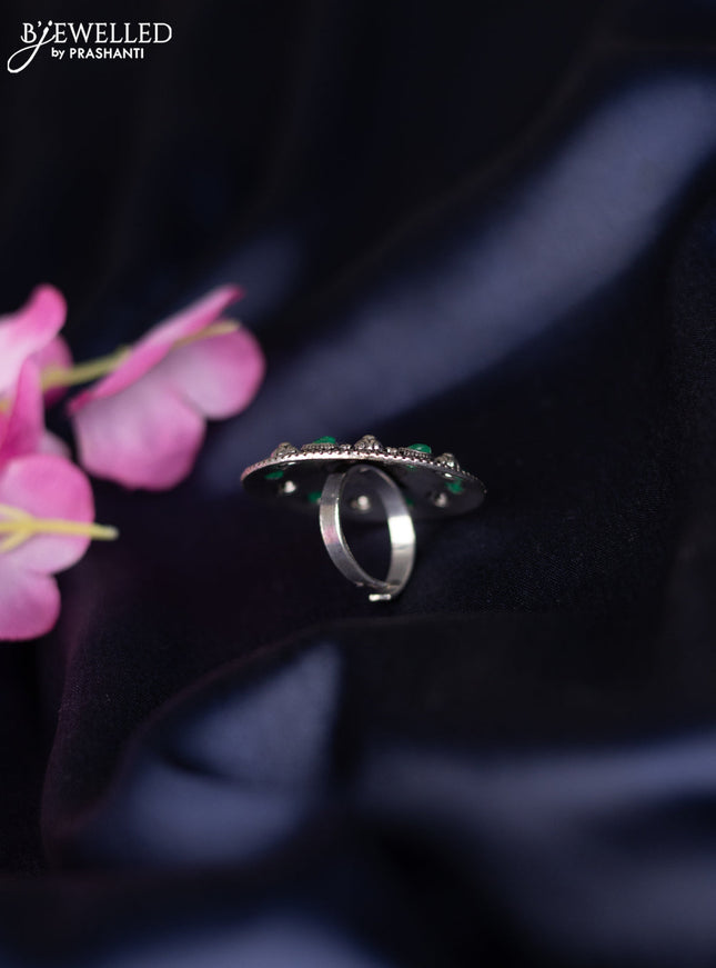 Oxidised ring with emerald stones