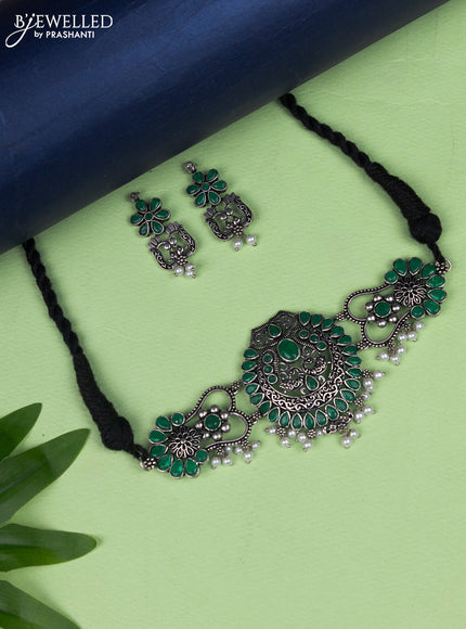 Oxidised choker peacock design with emerald stone and pearl hangings