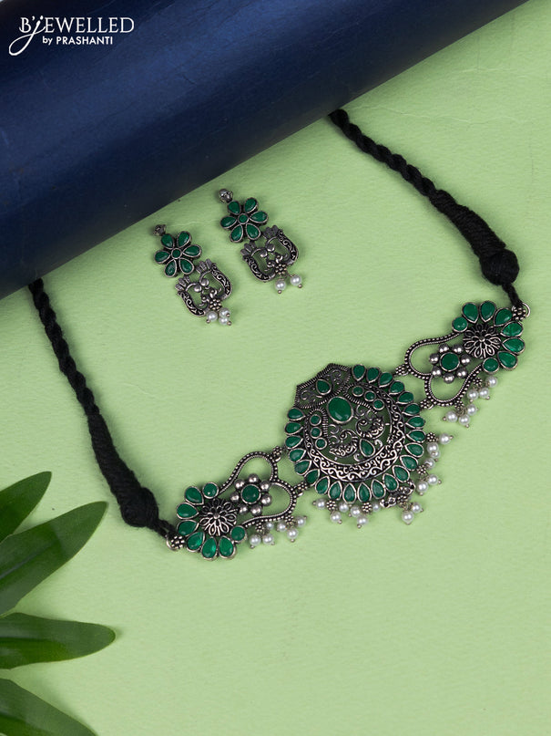 Oxidised choker peacock design with emerald stone and pearl hangings