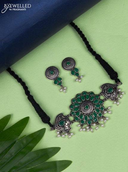Oxidised choker peacock design with emerald stone and pearl hangings
