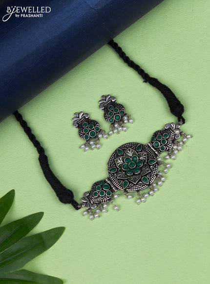 Oxidised choker kalasha design with emerald stone and pearl hangings