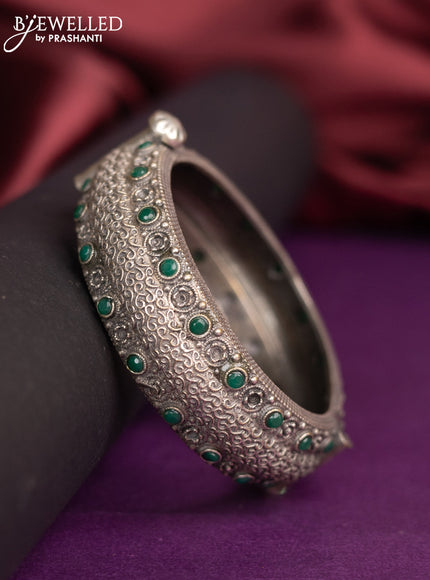 Oxidised screw type bangle with emerald stones