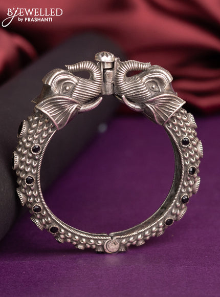 Oxidised elephant design screw type bangle with black stones