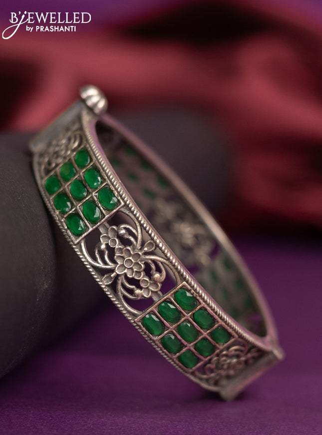 Oxidised screw type bangle with emerald stones