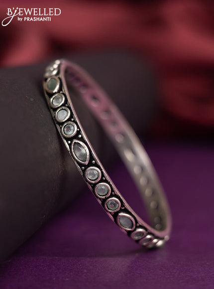 Oxidised bangle with mint green stones