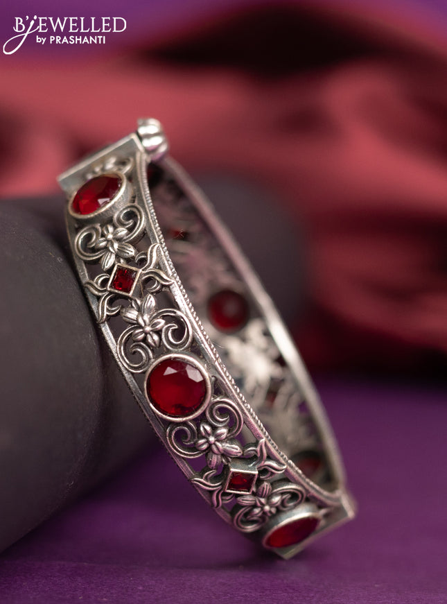 Oxidised screw type bangle with ruby stones