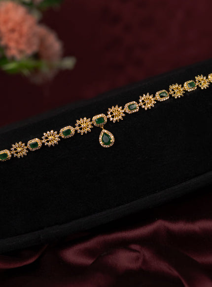 Zircon hip chain with emerald and cz stones in gold finish
