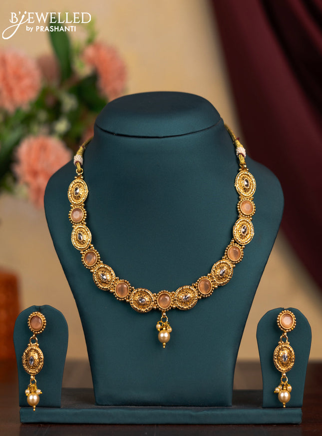 Antique necklace with peach and white stones