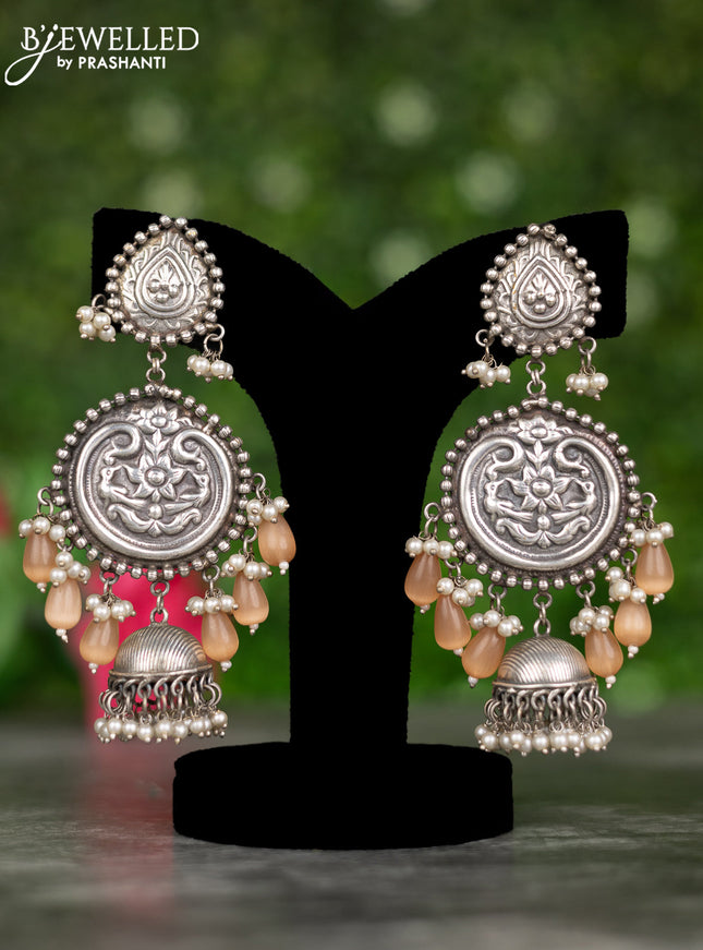 Oxidised earrings with floral design and pearl & peach beads hangings