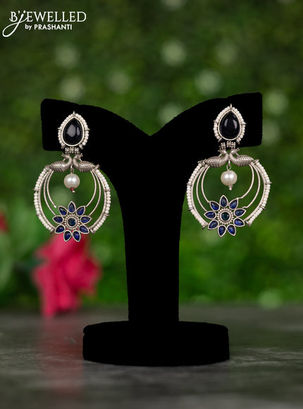 Oxidised earrings peacock design with sapphire stones and pearl hangings