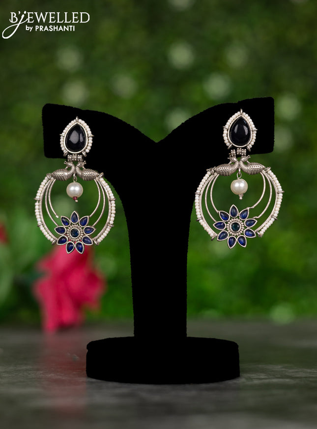 Oxidised earrings peacock design with sapphire stones and pearl hangings