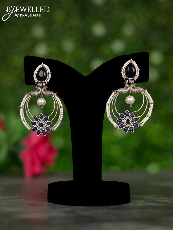 Oxidised earrings peacock design with sapphire stones and pearl hangings