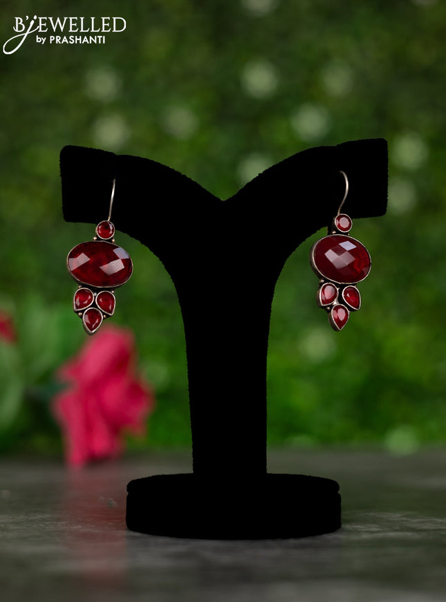 Oxidised hanging type earrings with maroon stones