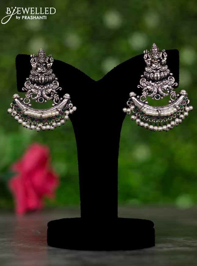 Oxidised earrings ganesha design with ruby & emerald stones and pearl hangings