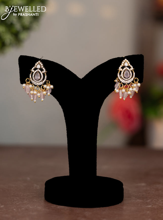 Earrings with baby pink & cz stones and beads hangings in victorian finish