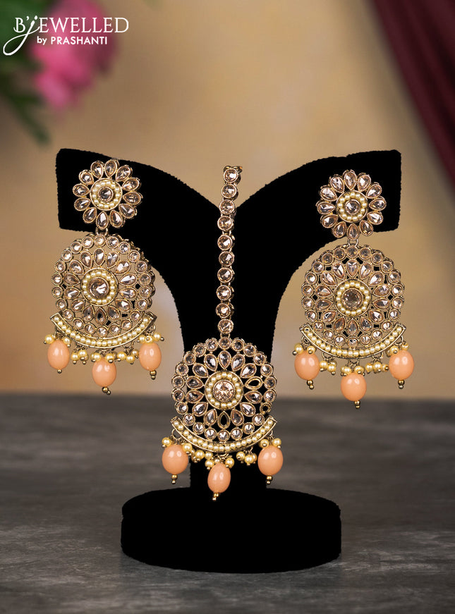 Kundan necklace with peach shade beads hangings and maang tikka