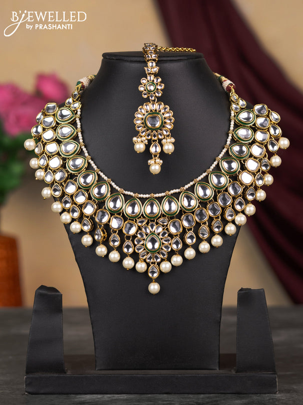 Kundan necklace with white kundan stone & pearl hangings and maang tikka without earring