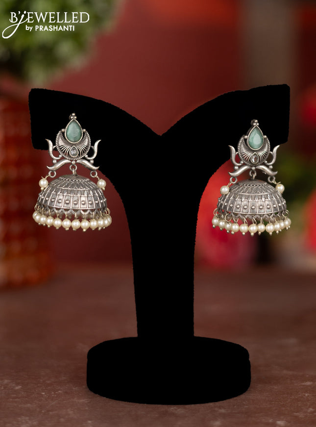 Oxidised jhumkas with mint green stones and pearl hangings