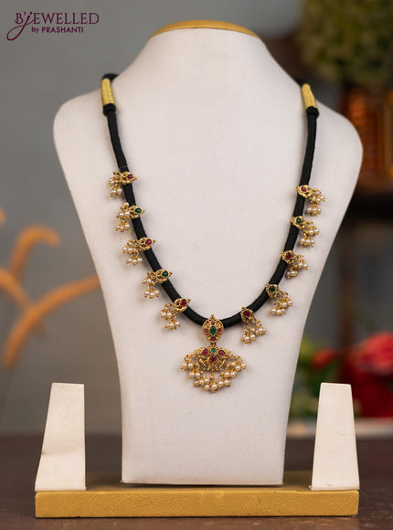 Black thread necklace with kemp stone and pearl hangings without earrings