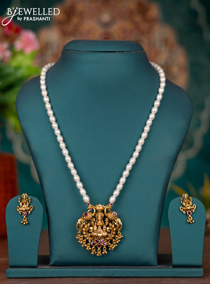 Pearl necklace lakshmi pendant with ruby stones and golden beads hangings