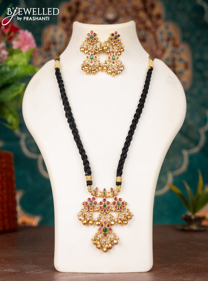 Black thread necklace with kemp stones & pearl and golden beads hanging
