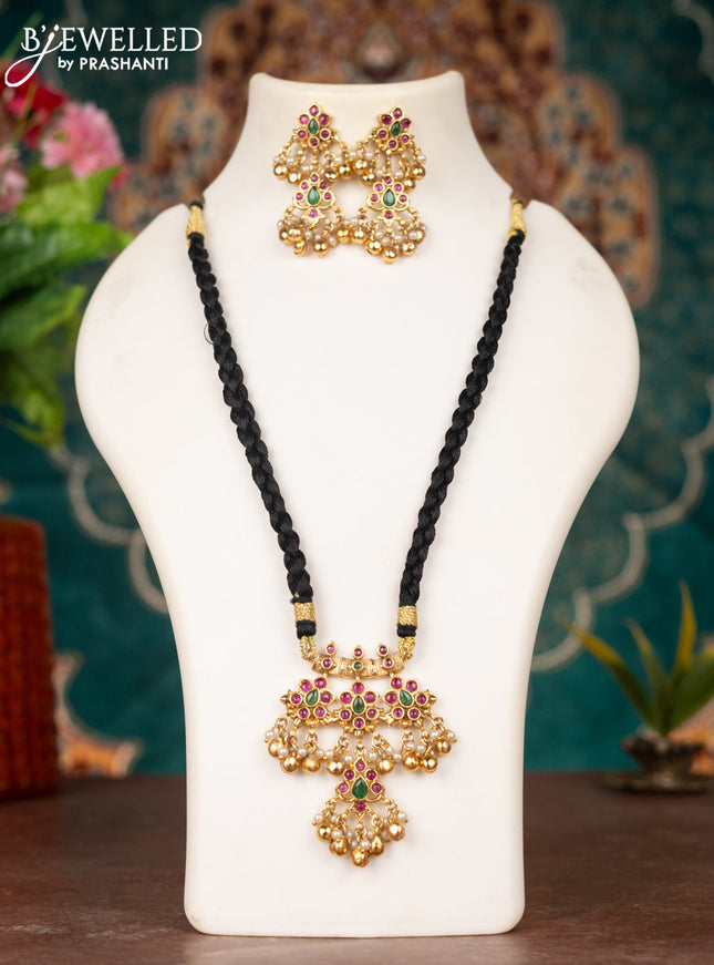 Black thread necklace with kemp stones & pearl and golden beads hanging