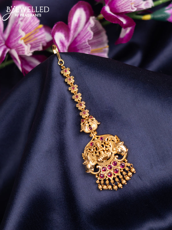 Antique maang tikka lakshmi design with pink kemp stones and golden beads hanging