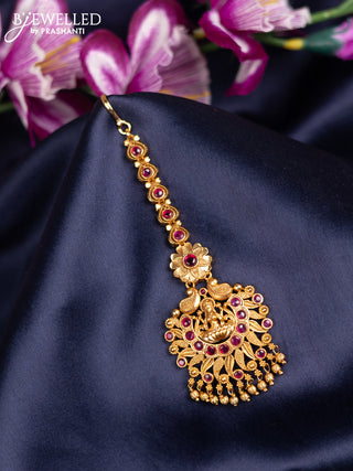 Antique maang tikka lakshmi design with pink kemp stones and golden beads hanging