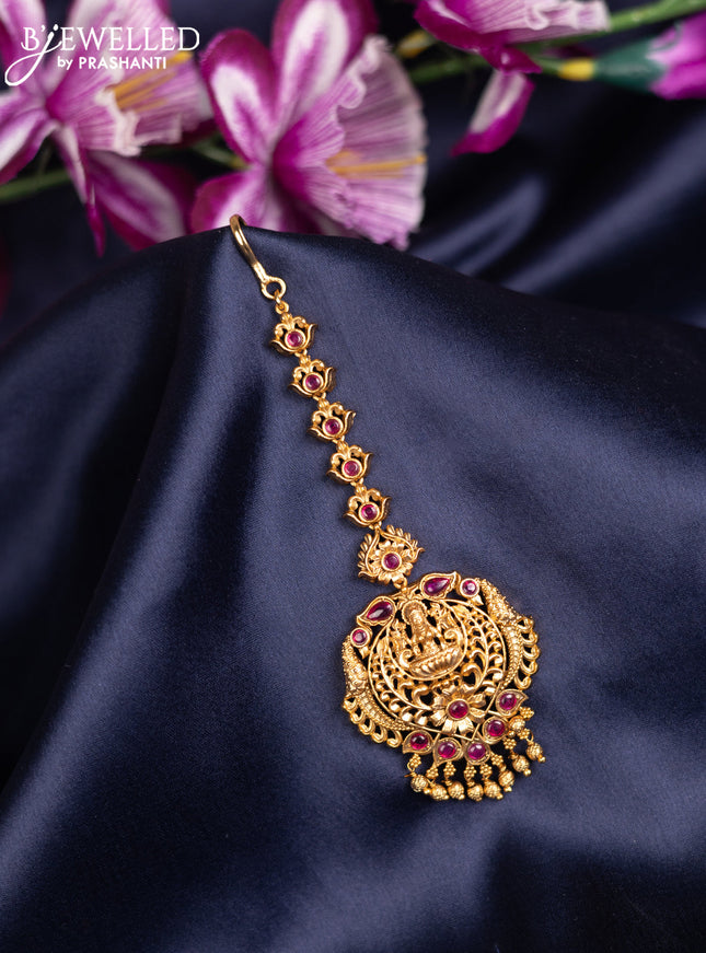 Antique maang tikka lakshmi design with pink kemp stones and golden beads hanging