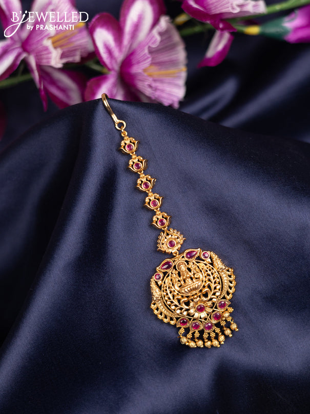 Antique maang tikka lakshmi design with pink kemp stones and golden beads hanging