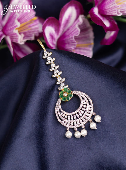 Zircon maang tikka with emerald & cz stones and pearl hanings in gold finish