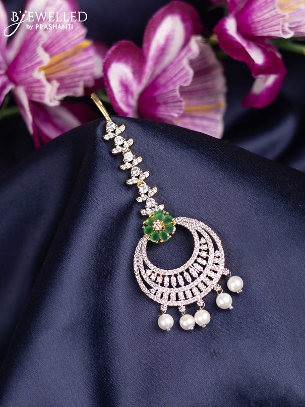 Zircon maang tikka with emerald & cz stones and pearl hanings in gold finish