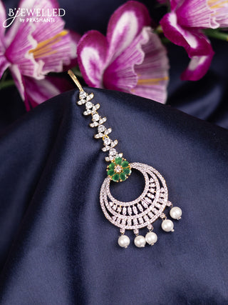Zircon maang tikka with emerald & cz stones and pearl hanings in gold finish