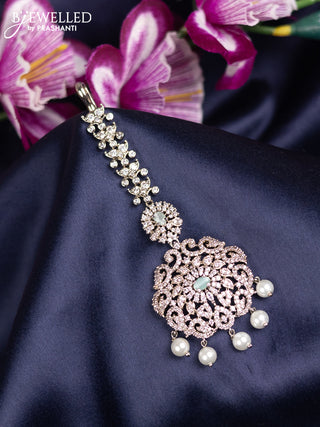 Zircon maang tikka with mint green & cz stones and pearl hanings