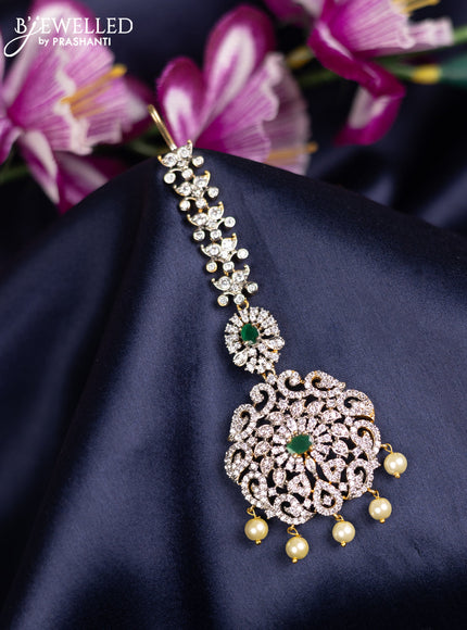 Zircon maang tikka with emerald & cz stones and pearl hanings in gold finish
